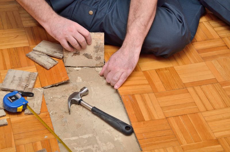Handyman Preparing for Floor Replacement